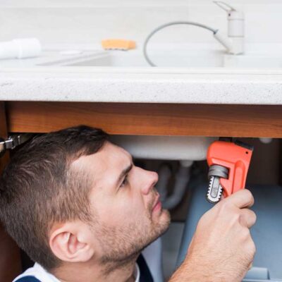 sanitary-technician-working-with-wrench-kitchen-1000